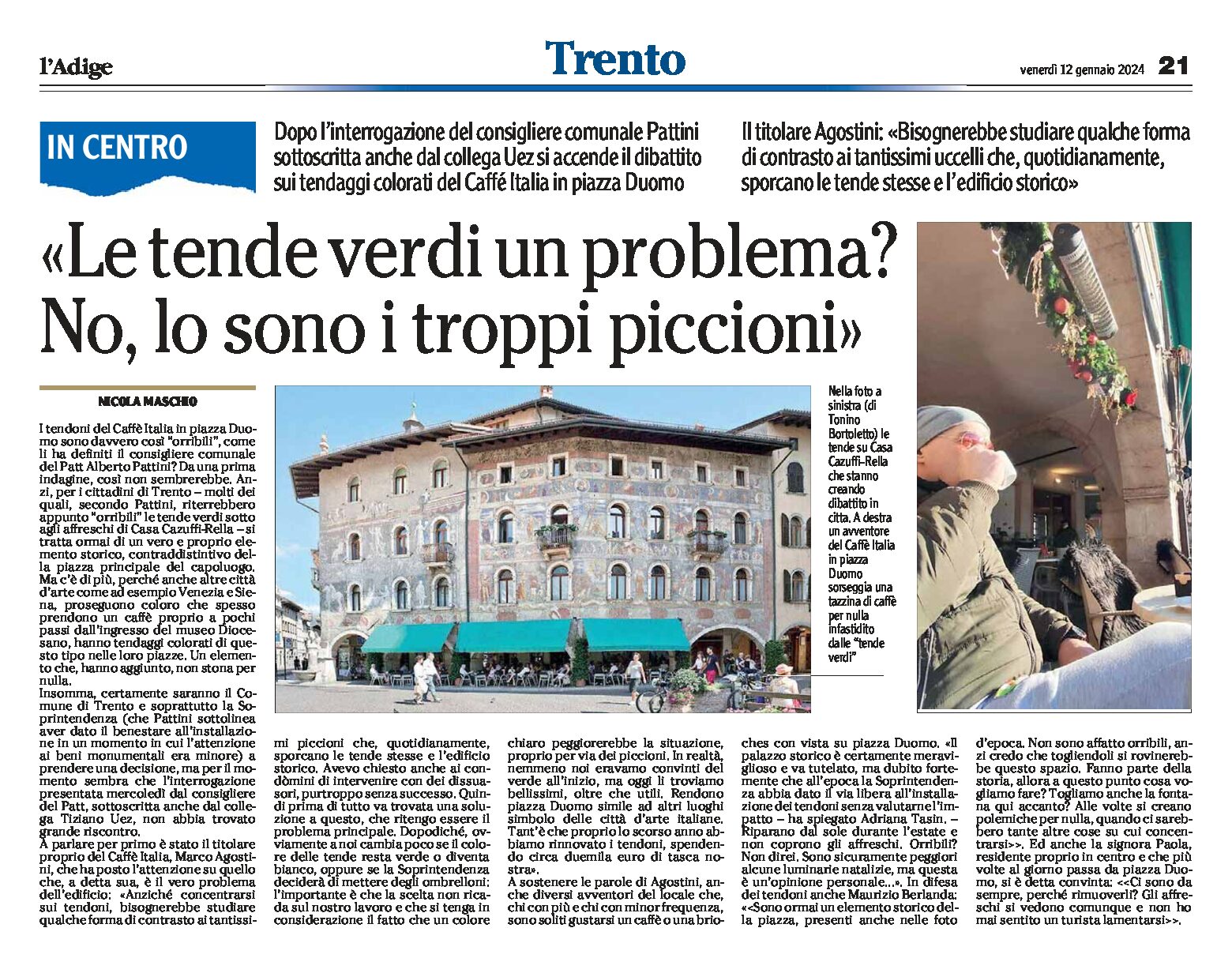 Trento, piazza Duomo: le tende verdi sotto gli affreschi… e i piccioni?
